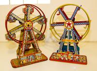 A Pair of Tin Ferris Wheels Height 16 1/2 inches. — MID 20TH CENTURY