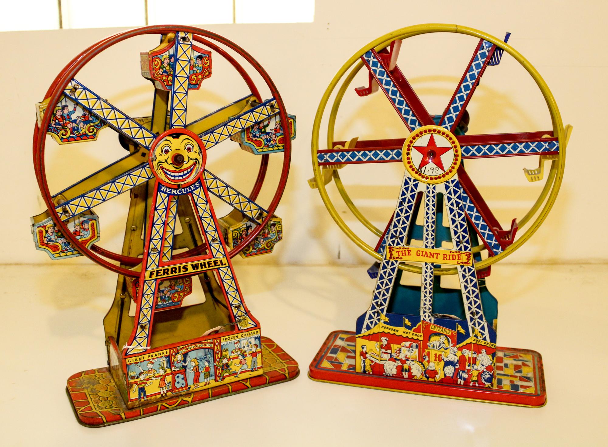 A Pair of Tin Ferris Wheels Height 16 1/2 inches. — MID 20TH CENTURY