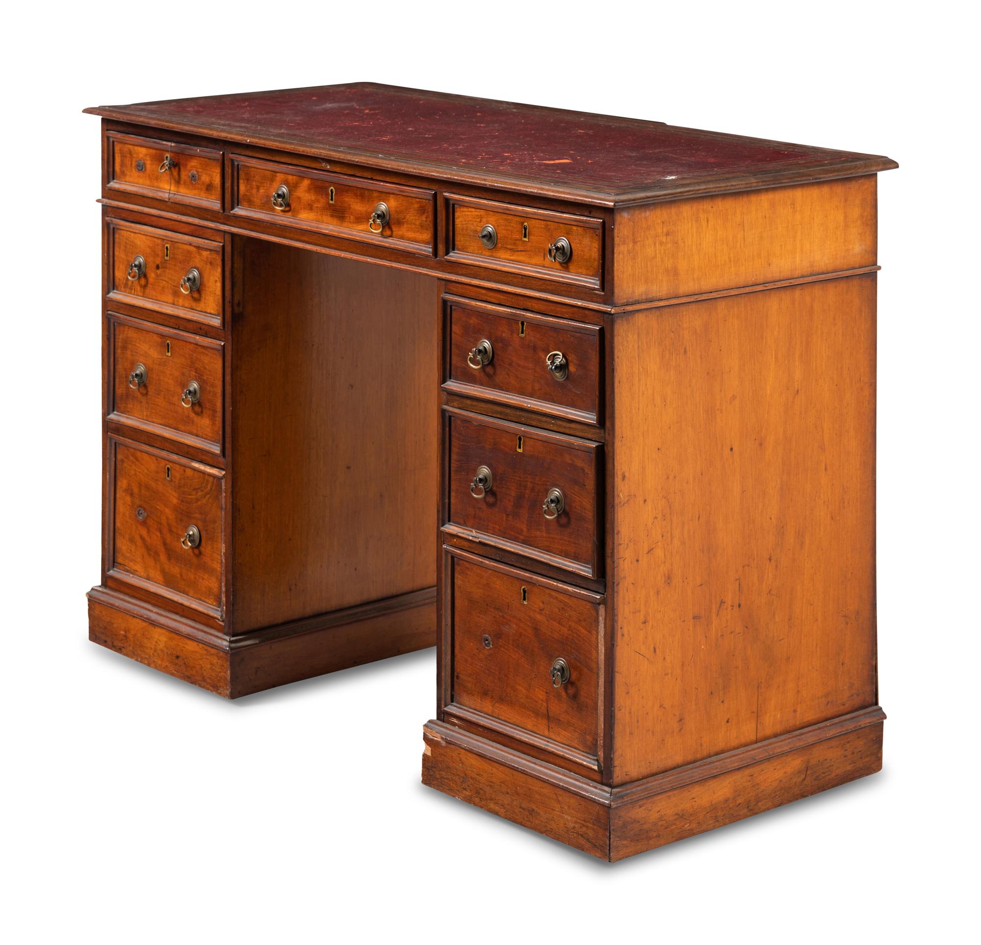 An Edwardian Walnut Pedestal Desk