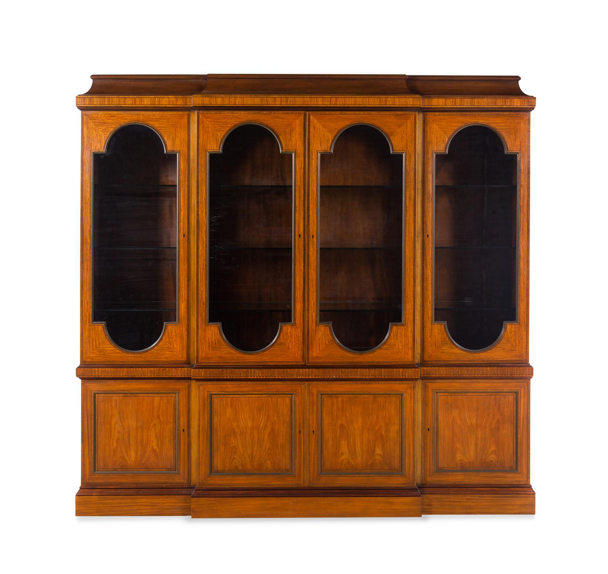 A Baker George III Style Satinwood and Fruitwood Breakfront Bookcase