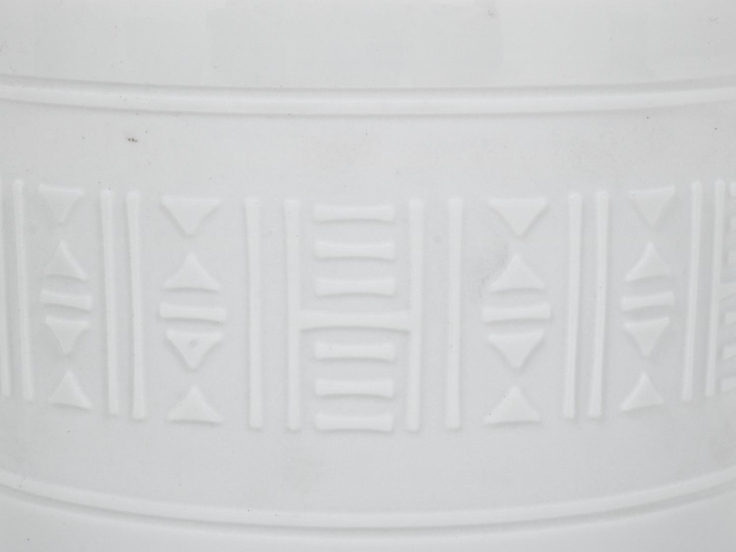 A Group of Hermès Egée Porcelain Cups and Saucers