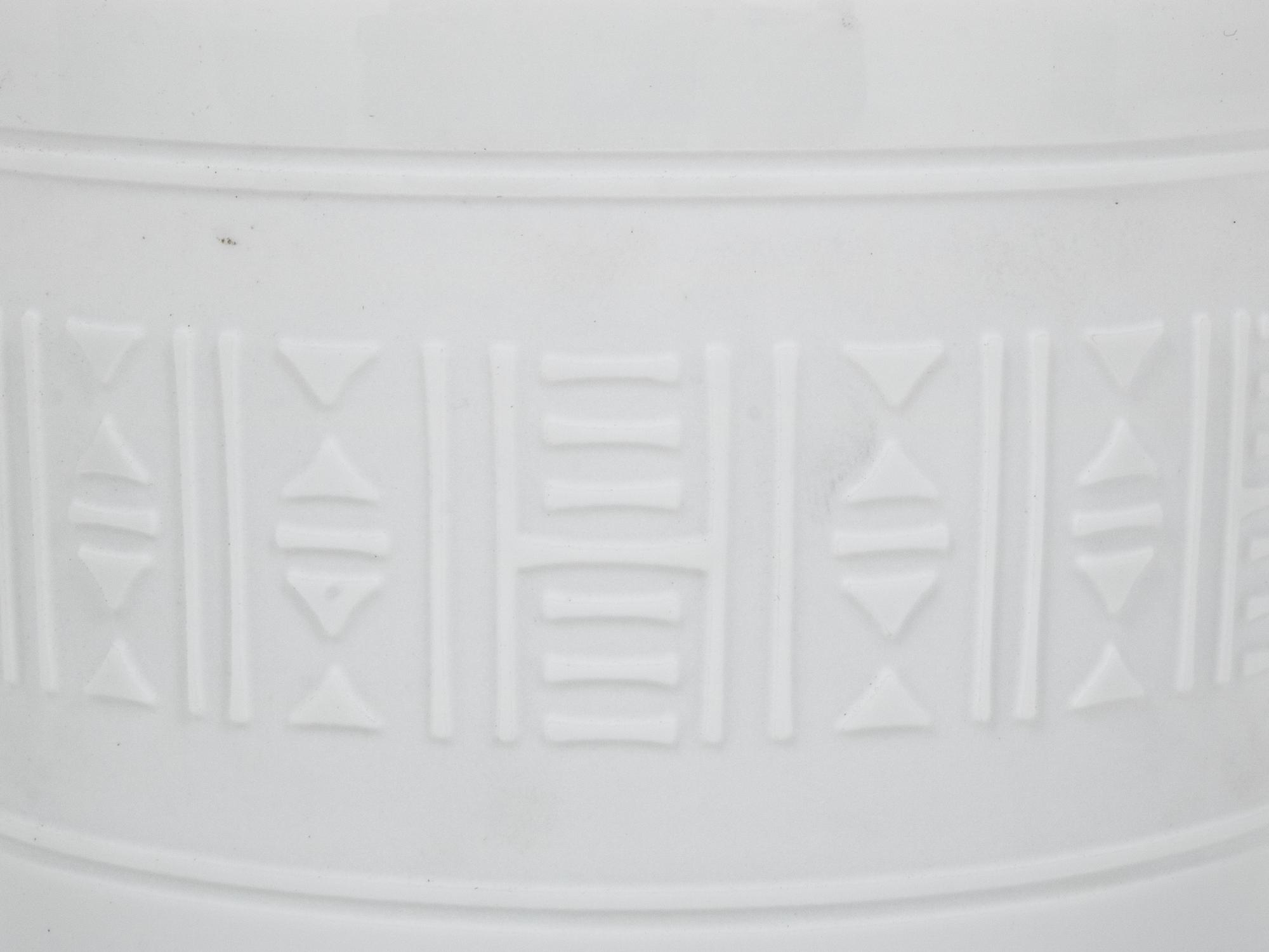 A Group of Hermès Egée Porcelain Cups and Saucers