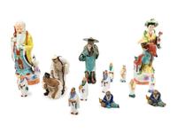 Fourteen Chinese Polychrome Enameled Porcelain and Pottery Figures