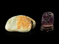 A Celadon Jade 'Lychee' Carving and An Amethyst 'Fruit' Pendant