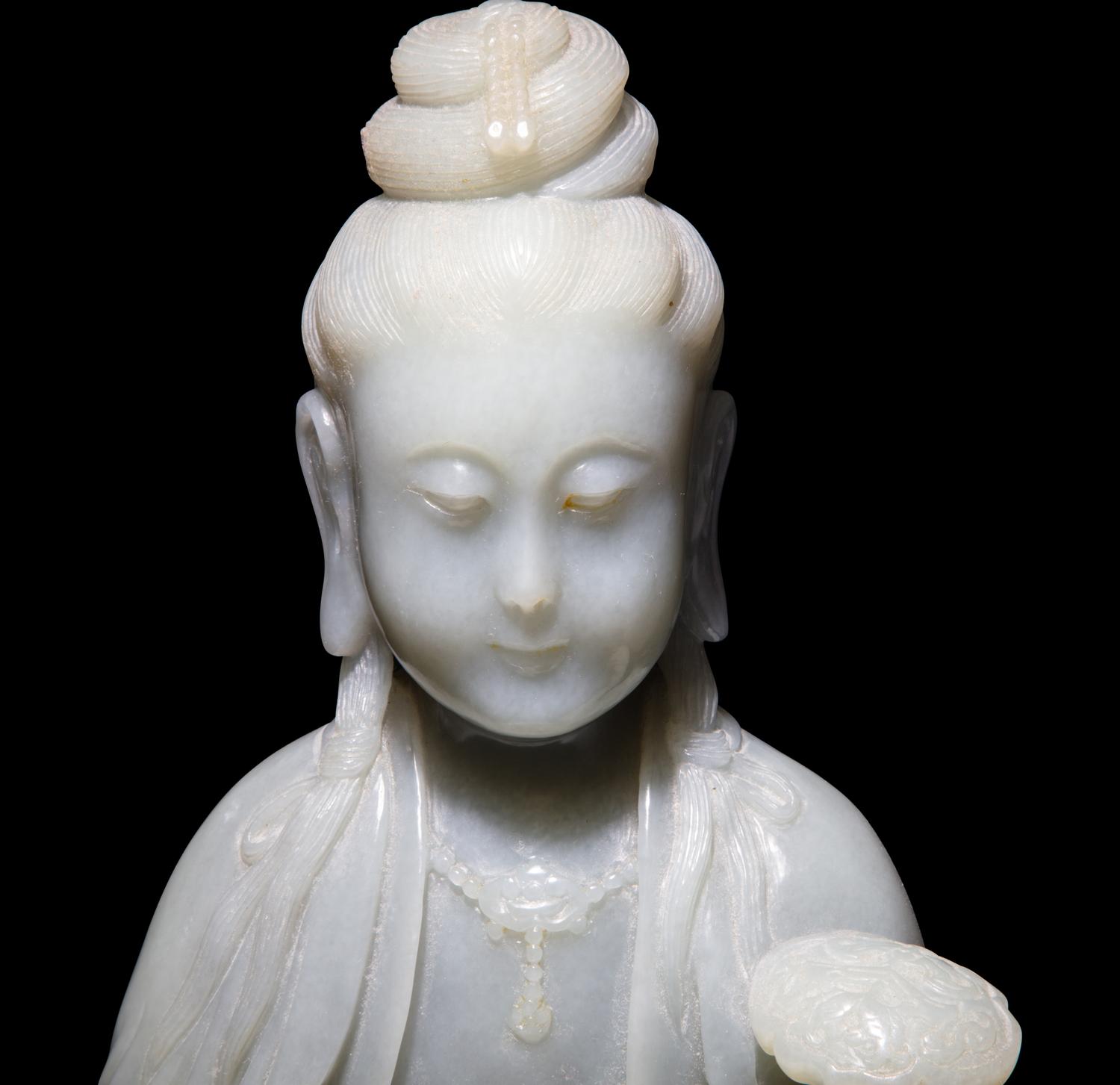 A Chinese Celadon Jade Seated Guanyin, 20th Century — 近代 青玉觀音坐像