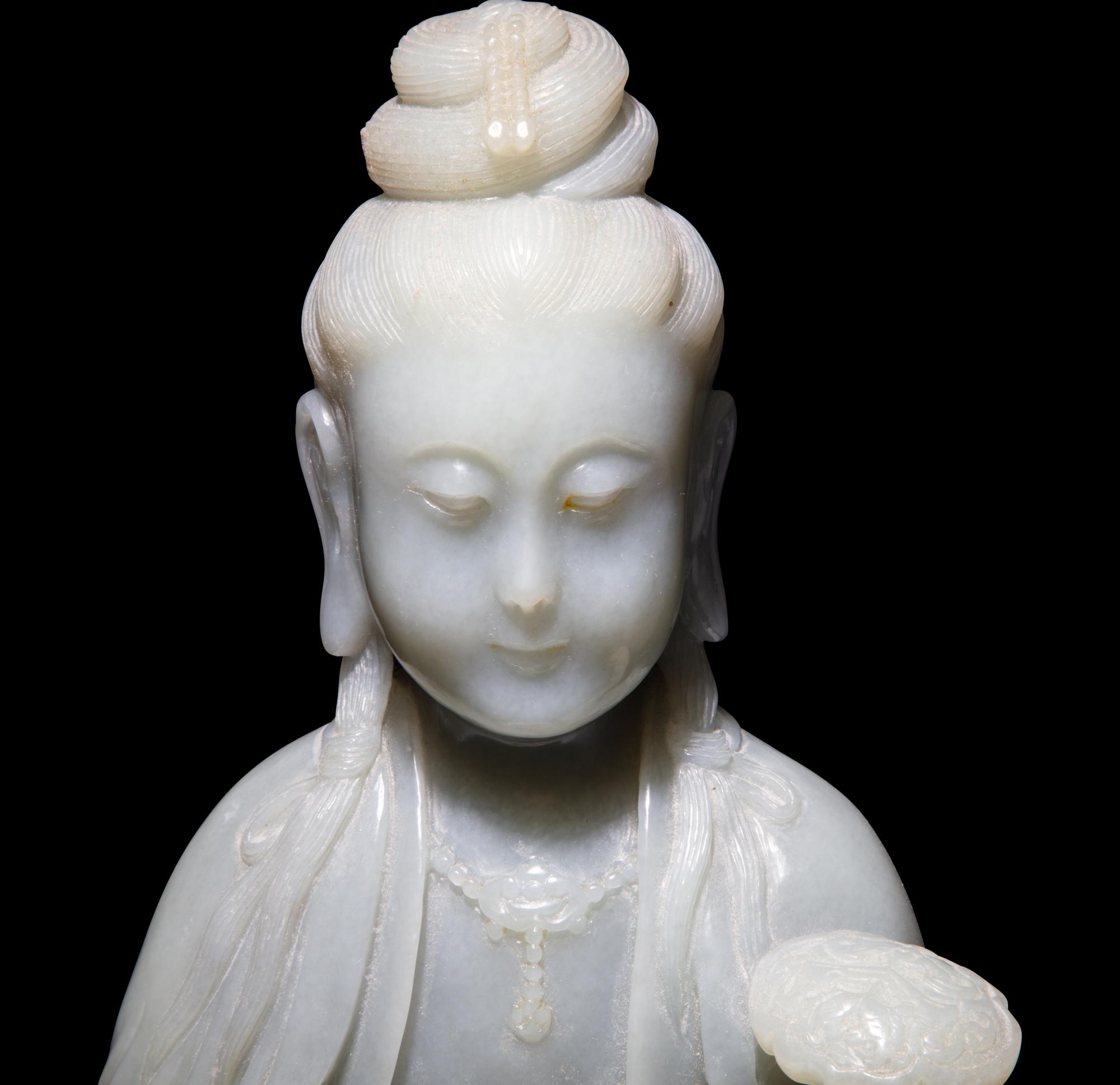 A Chinese Celadon Jade Seated Guanyin, 20th Century — 近代 青玉觀音坐像