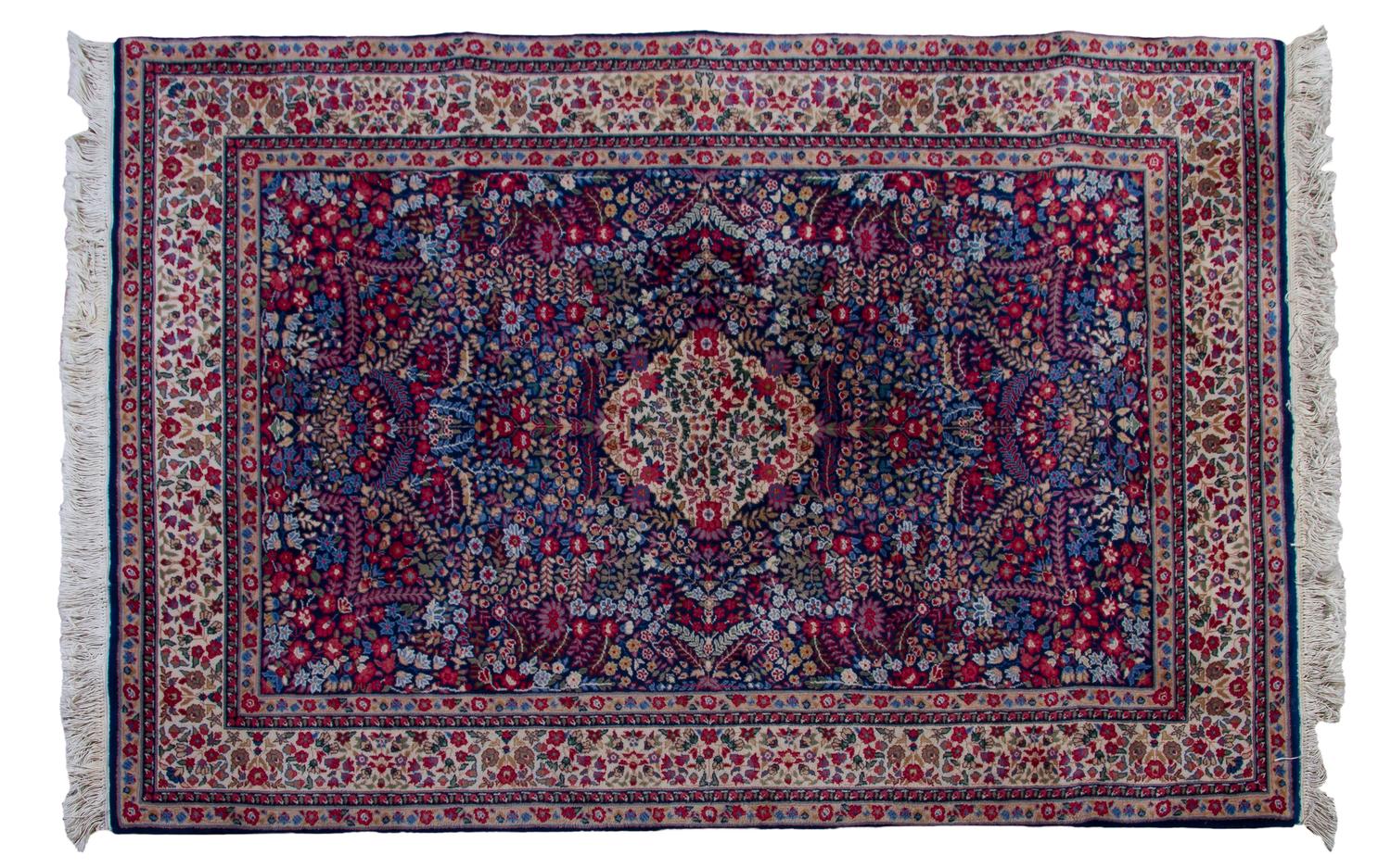 A Persian Wool Carpet, 6 feet 7 inches x 4 feet 5 inches.