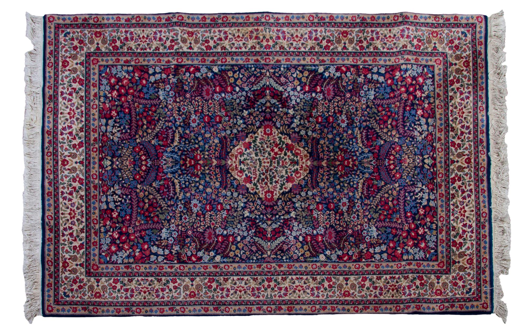 A Persian Wool Carpet, 6 feet 7 inches x 4 feet 5 inches.