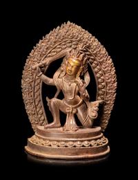 A Sino-Tibetan Bronze Figure of a Deity
