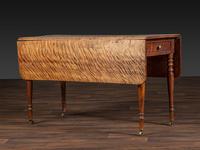 A Late Federal Figured Birch Drop Leaf Dining Table
