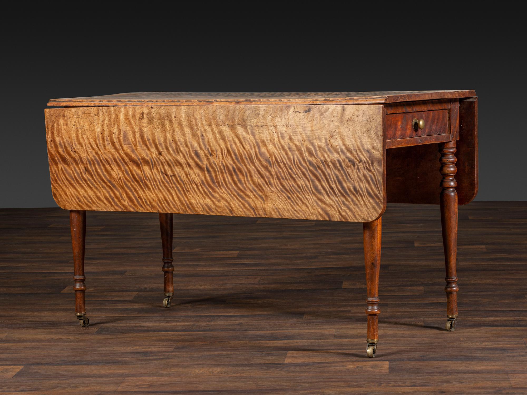 A Late Federal Figured Birch Drop Leaf Dining Table
