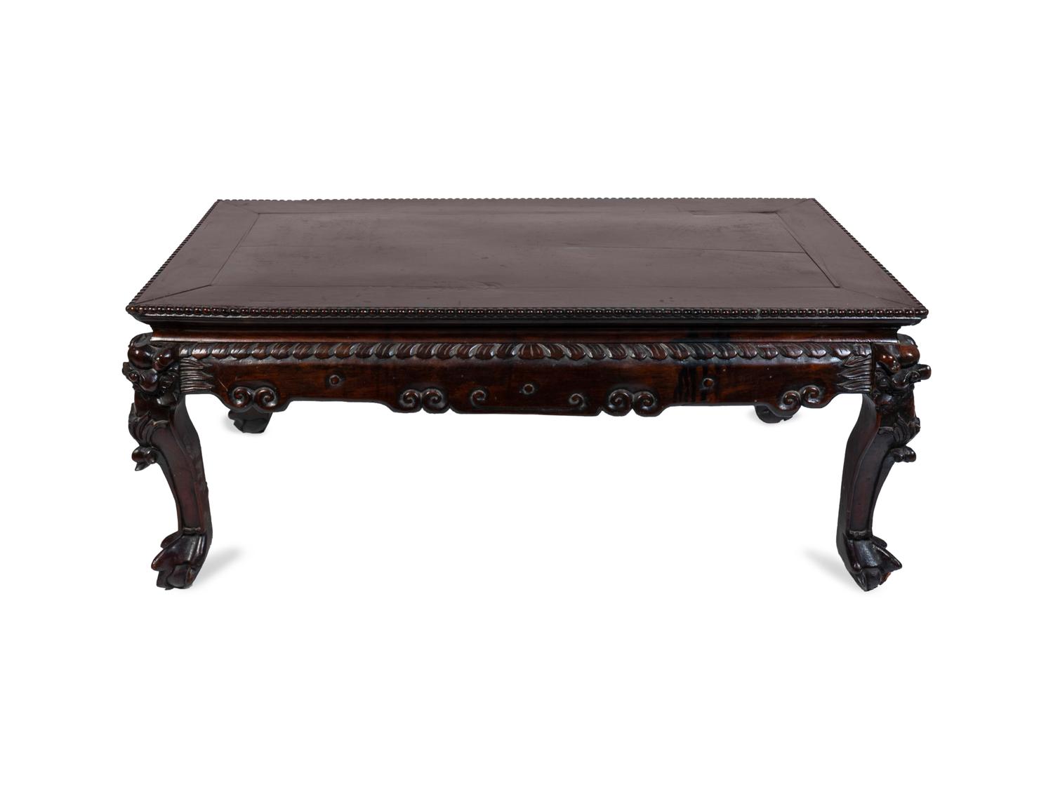 A Chinese Carved Hardwood Low Table — 19TH CENTURY