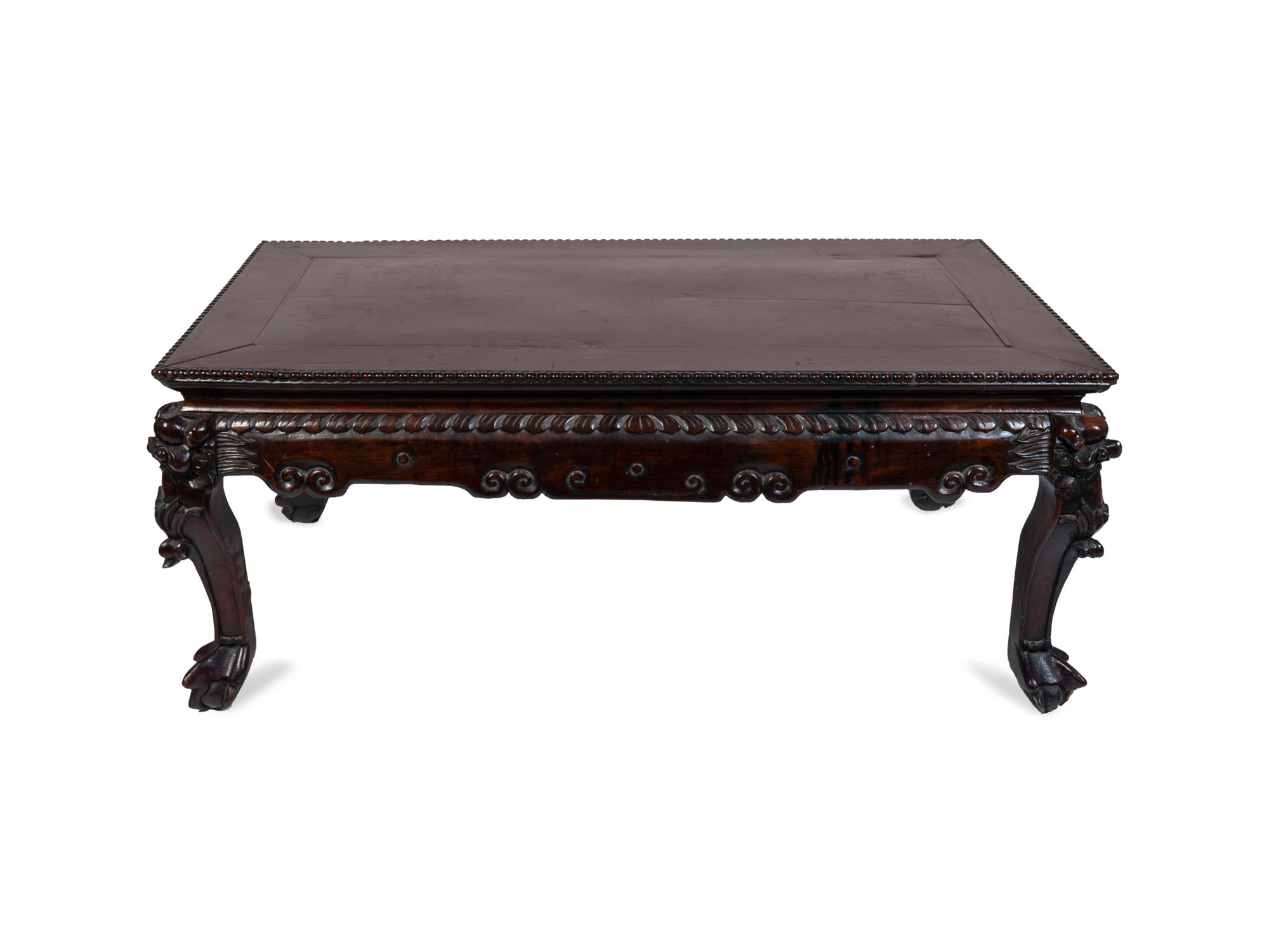 A Chinese Carved Hardwood Low Table — 19TH CENTURY