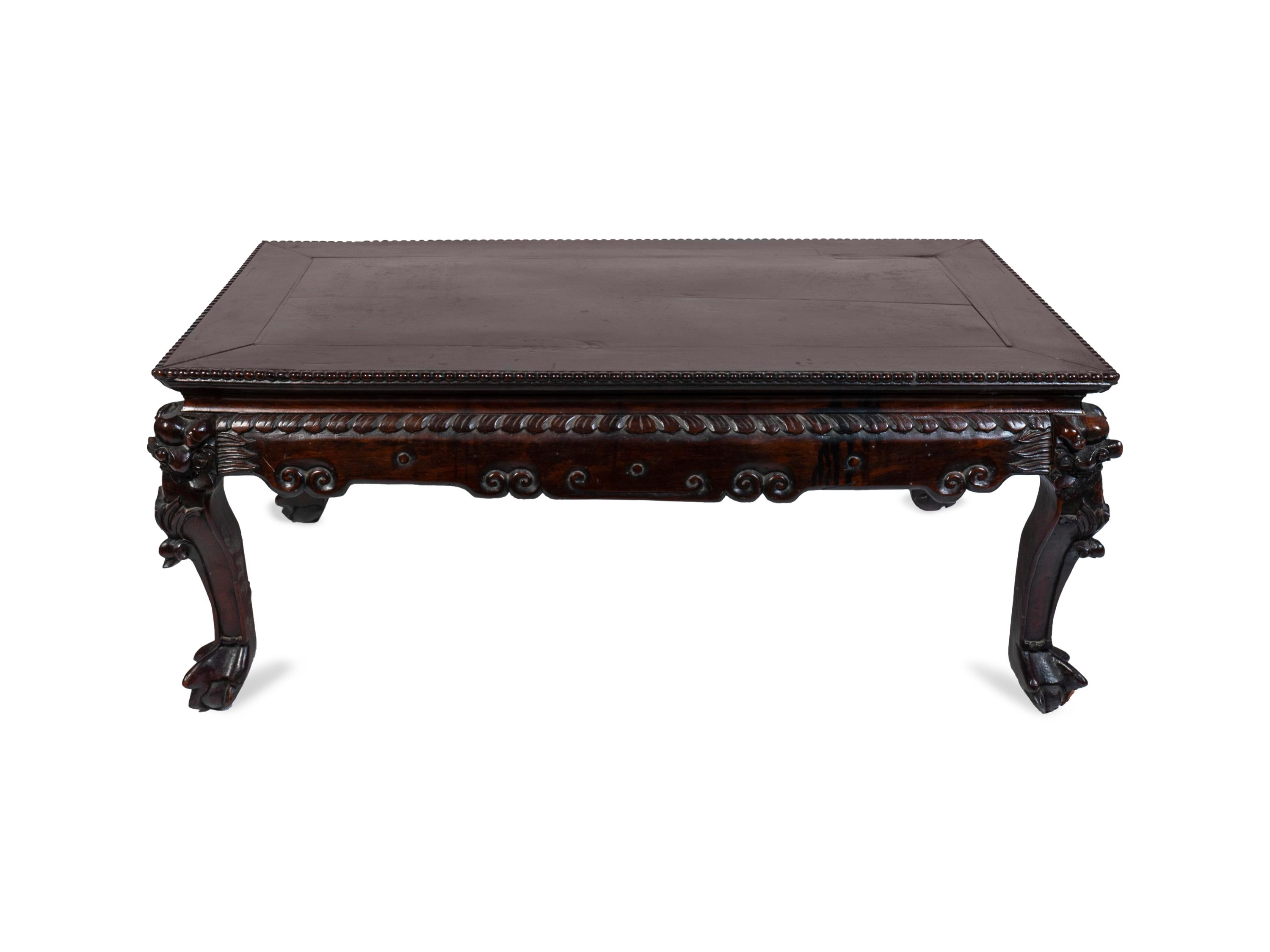 A Chinese Carved Hardwood Low Table — 19TH CENTURY