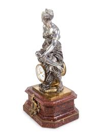 A Napoleon III Gilt and Silvered Bronze and Rouge Griotte Marble Figural Clock