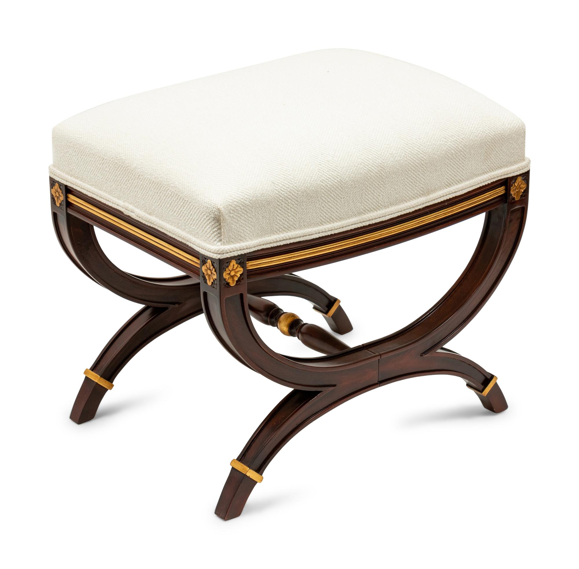 A Directoire Style Parcel Gilt Ottoman