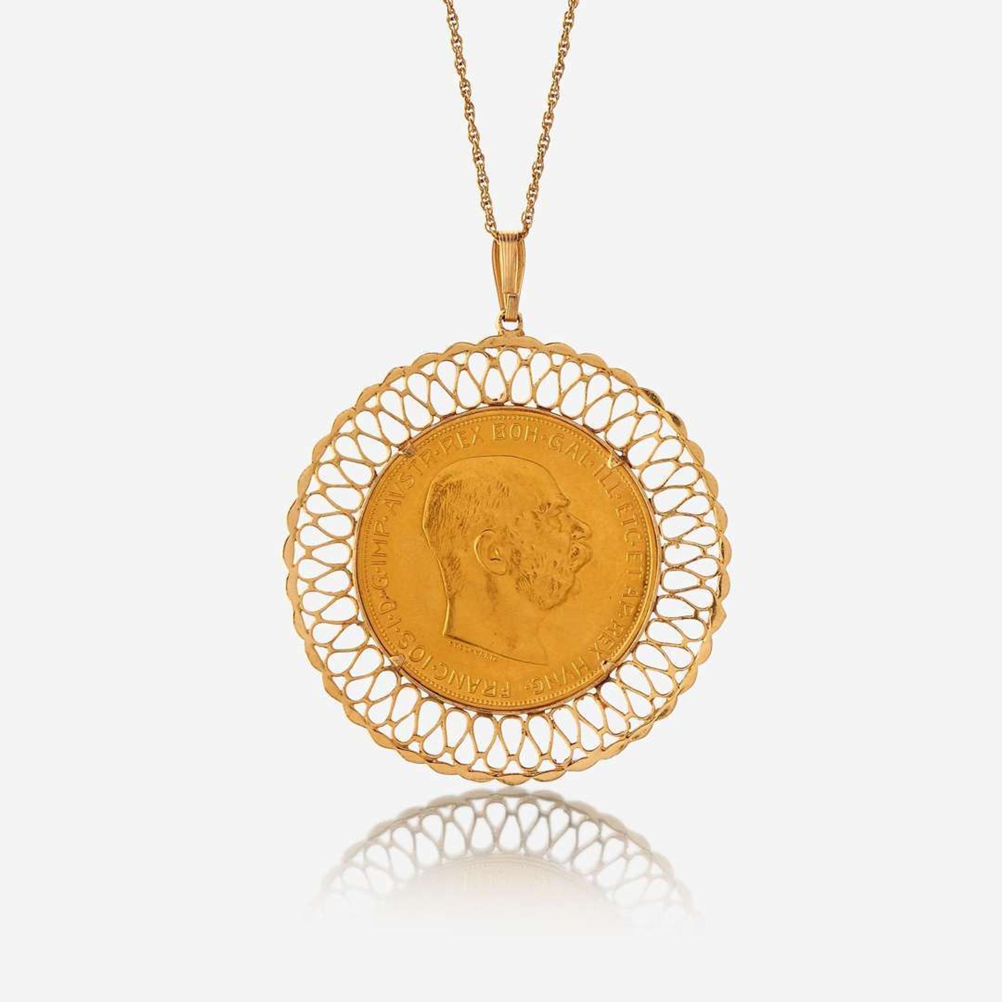 An eighteen karat gold coin pendant
