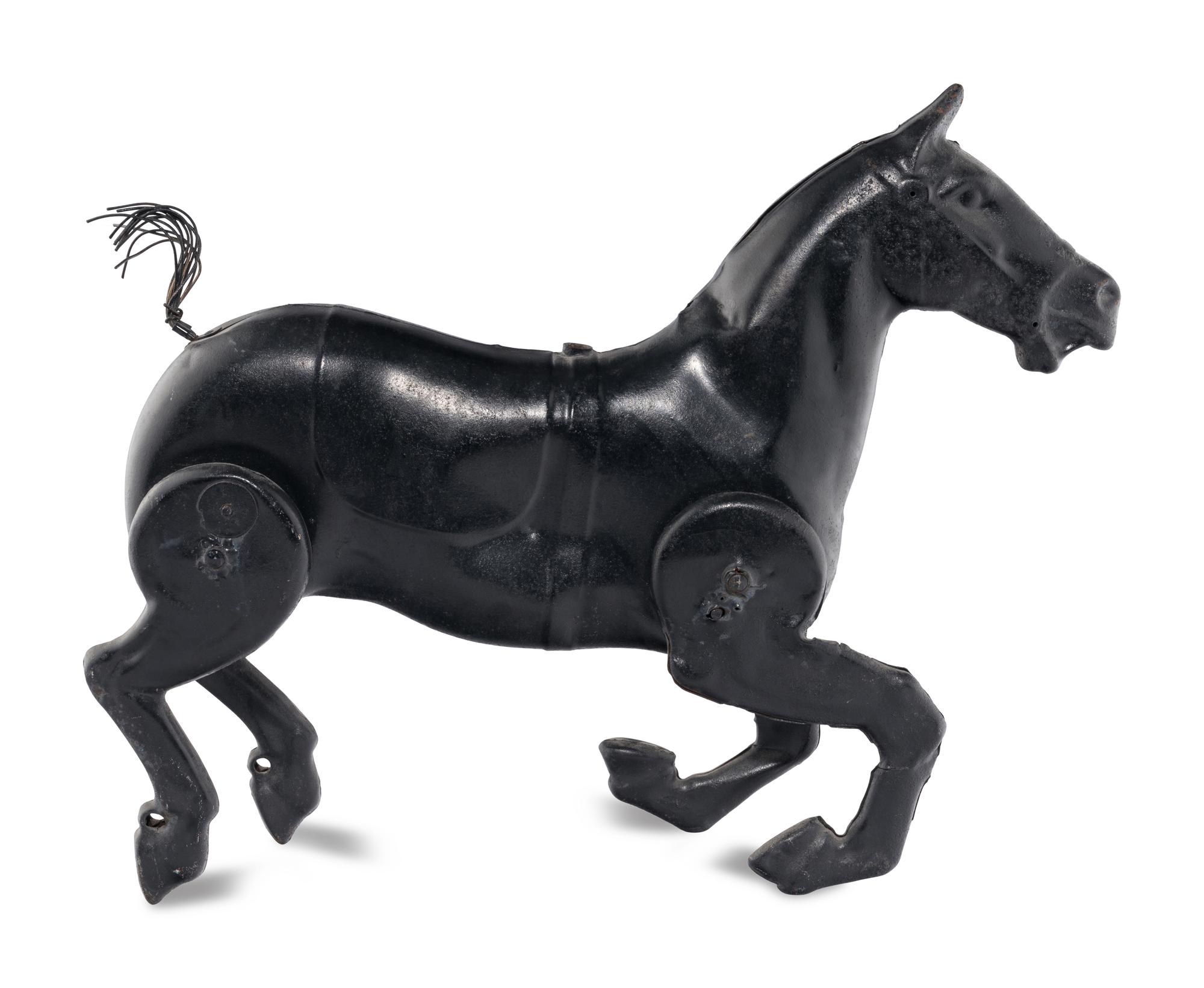 A Pressed Metal Horse Carousel Figure