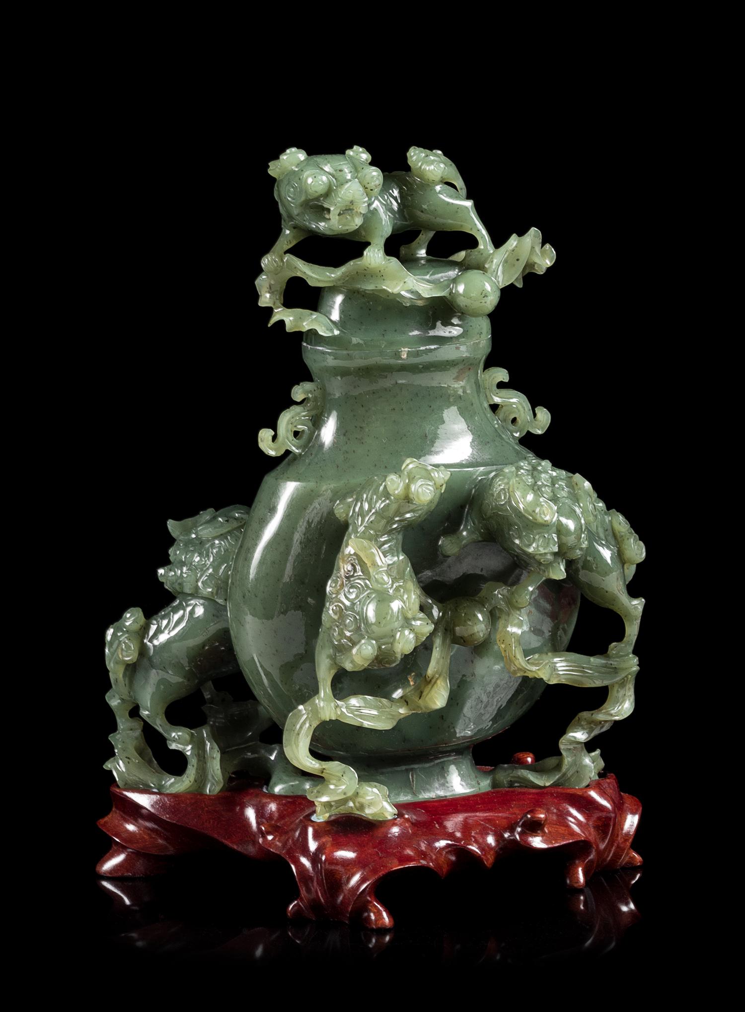 A Spinach Jade 'Fu Lion' Vase and Cover Height 8 inches. — EARLY 20TH CENTURY