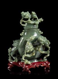 A Spinach Jade 'Fu Lion' Vase and Cover Height 8 inches. — EARLY 20TH CENTURY