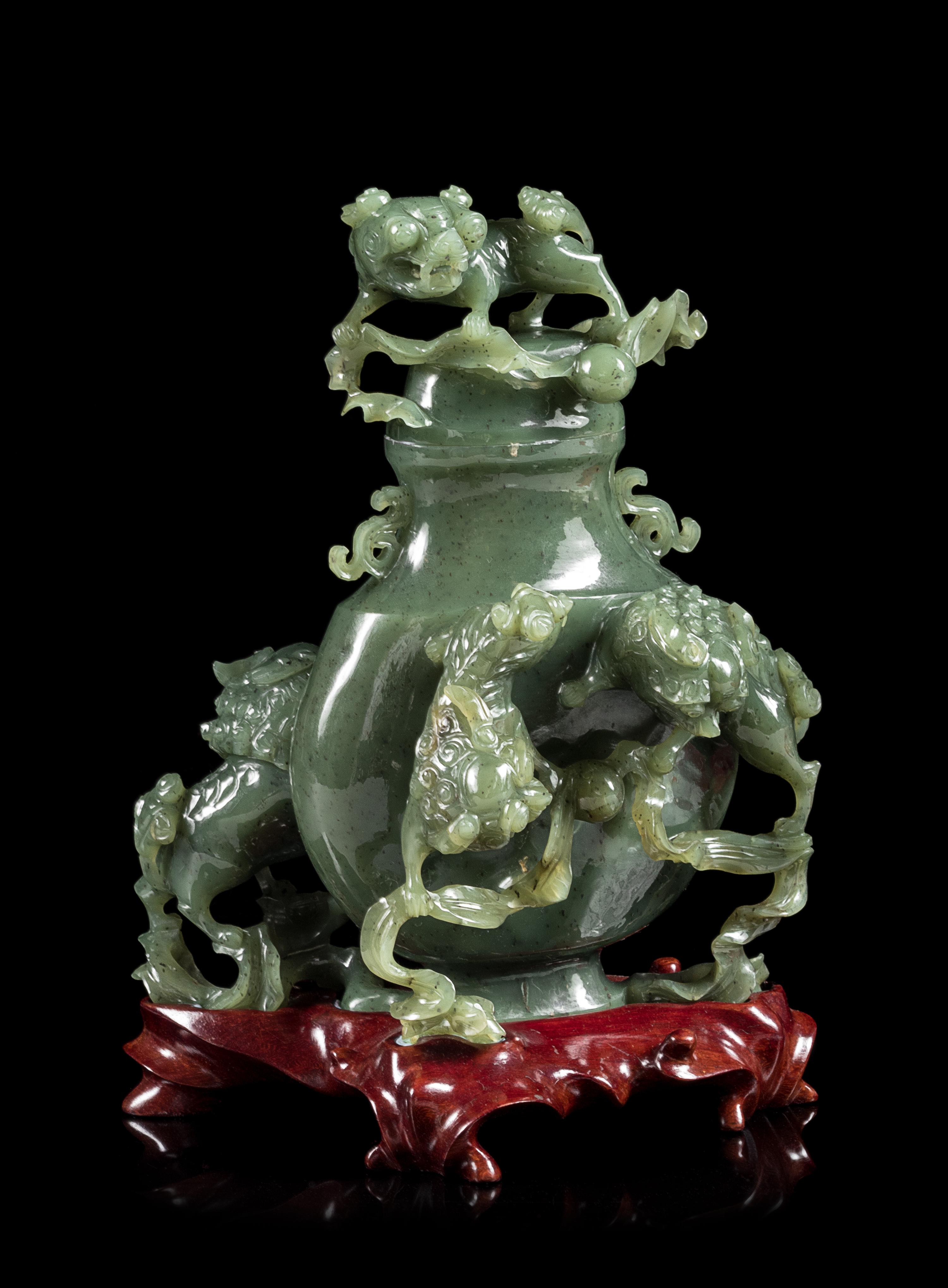A Spinach Jade 'Fu Lion' Vase and Cover Height 8 inches. — EARLY 20TH CENTURY