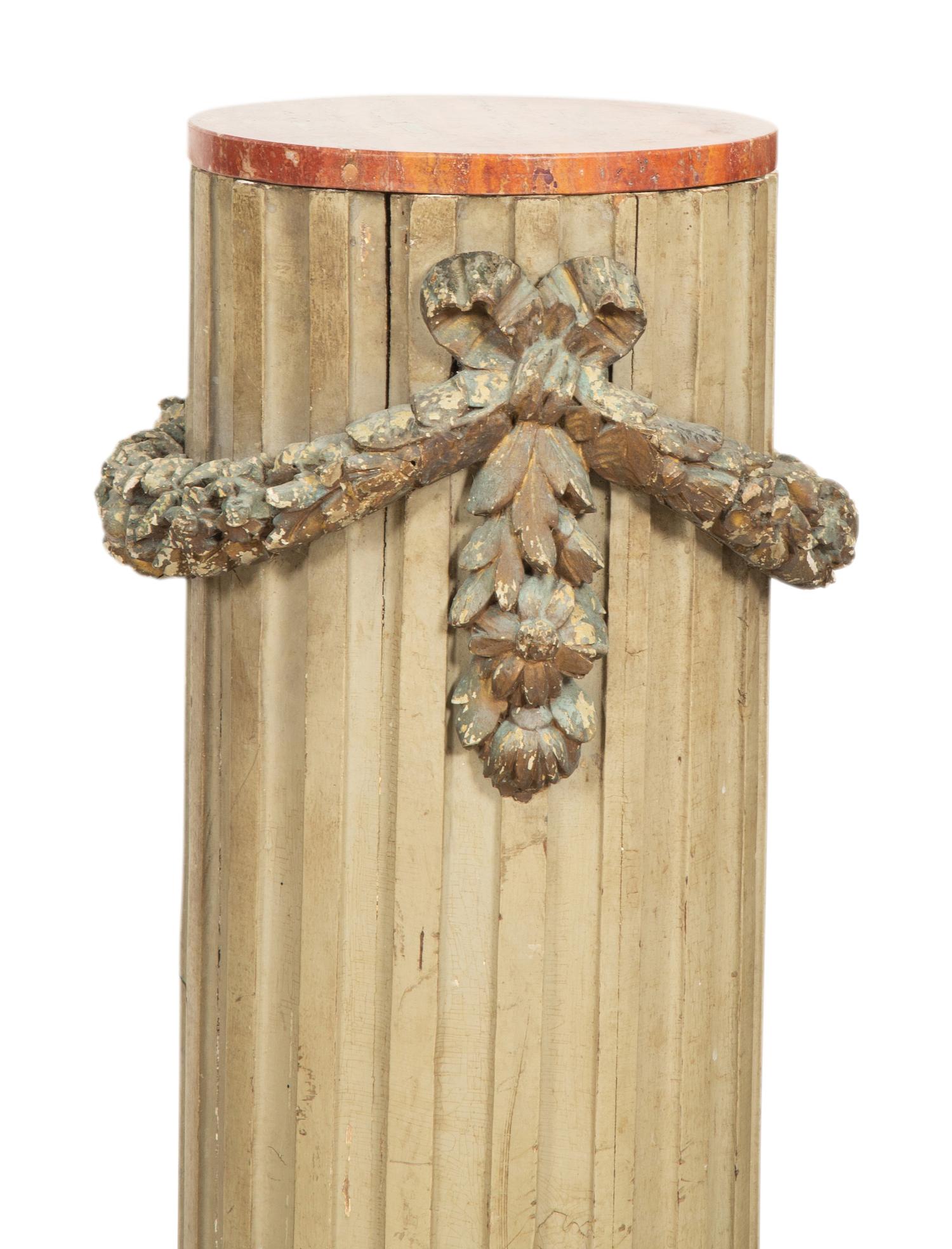 A Pair of Italian Carved and Painted Pedestals