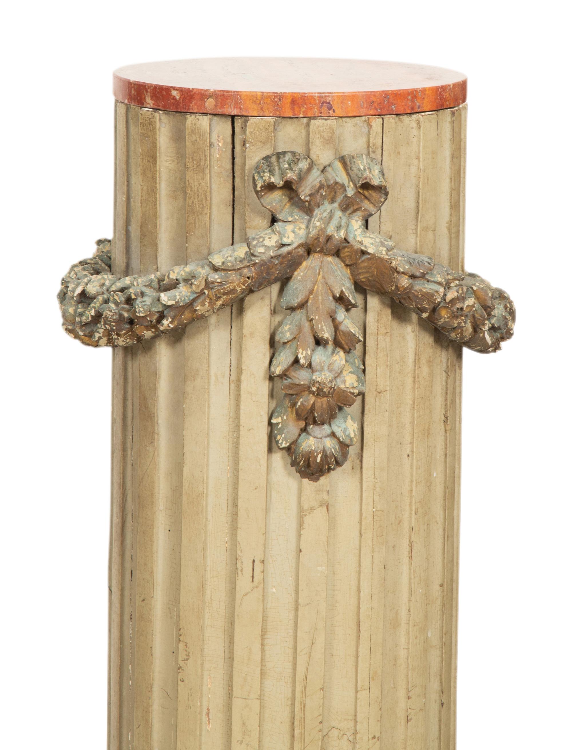A Pair of Italian Carved and Painted Pedestals