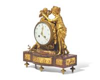 A Louis XVI Style Gilt-Bronze Mounted Rouge Marble Mantel Clock