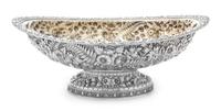 An American Silver Center Bowl, Tiffany & Co., New York, NY, the rim worked to show rocaille and C-scroll elements, the body having rep