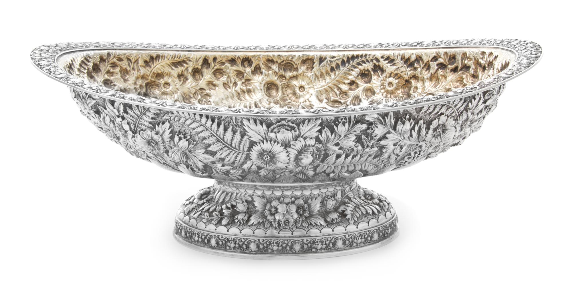 An American Silver Center Bowl, Tiffany & Co., New York, NY, the rim worked to show rocaille and C-scroll elements, the body having rep