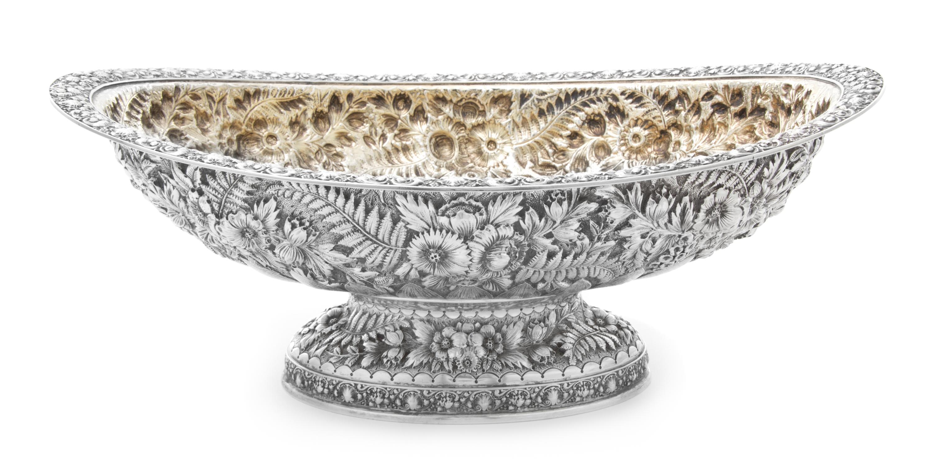 An American Silver Center Bowl, Tiffany & Co., New York, NY, the rim worked to show rocaille and C-scroll elements, the body having rep