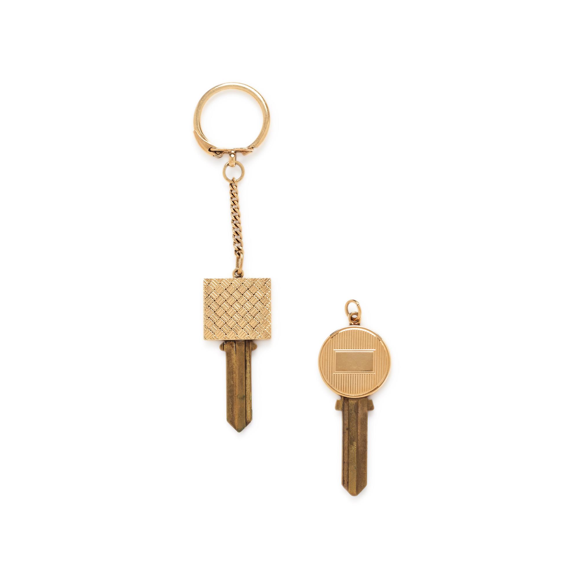 COLLECTION OF YELLOW GOLD KEY TOPPERS