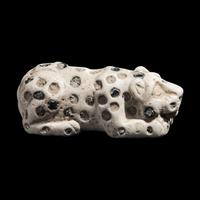 A Mesopotamian Marble and Lapis Lazuli Inlay Recumbent Feline