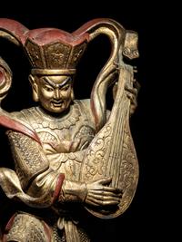 A Set of Four Gilt and Red Lacquered Wood Figures of Guardians