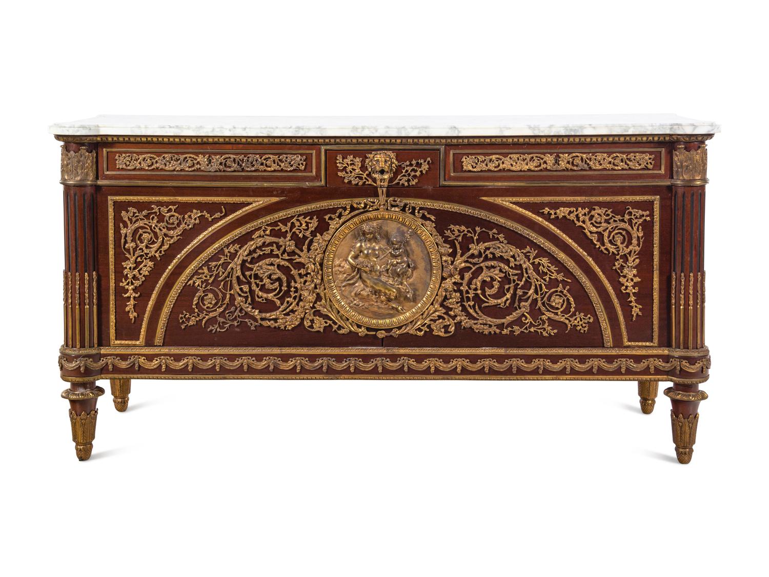 A Louis XVI Style Gilt Bronze Mounted Mahogany Marble-Top Commode à Vantaux After the Model by Guillaume Benneman