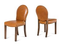 A Set of Eight Leather-Upholstered Dining Chairs