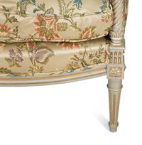 A Pair of Louis XVI Style Painted and Parcel Gilt Bergères