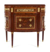 A Louis XVI Style Gilt Bronze Mounted Chest of Drawers