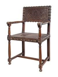 A Spanish Baroque Leather-Upholstered Walnut Armchair