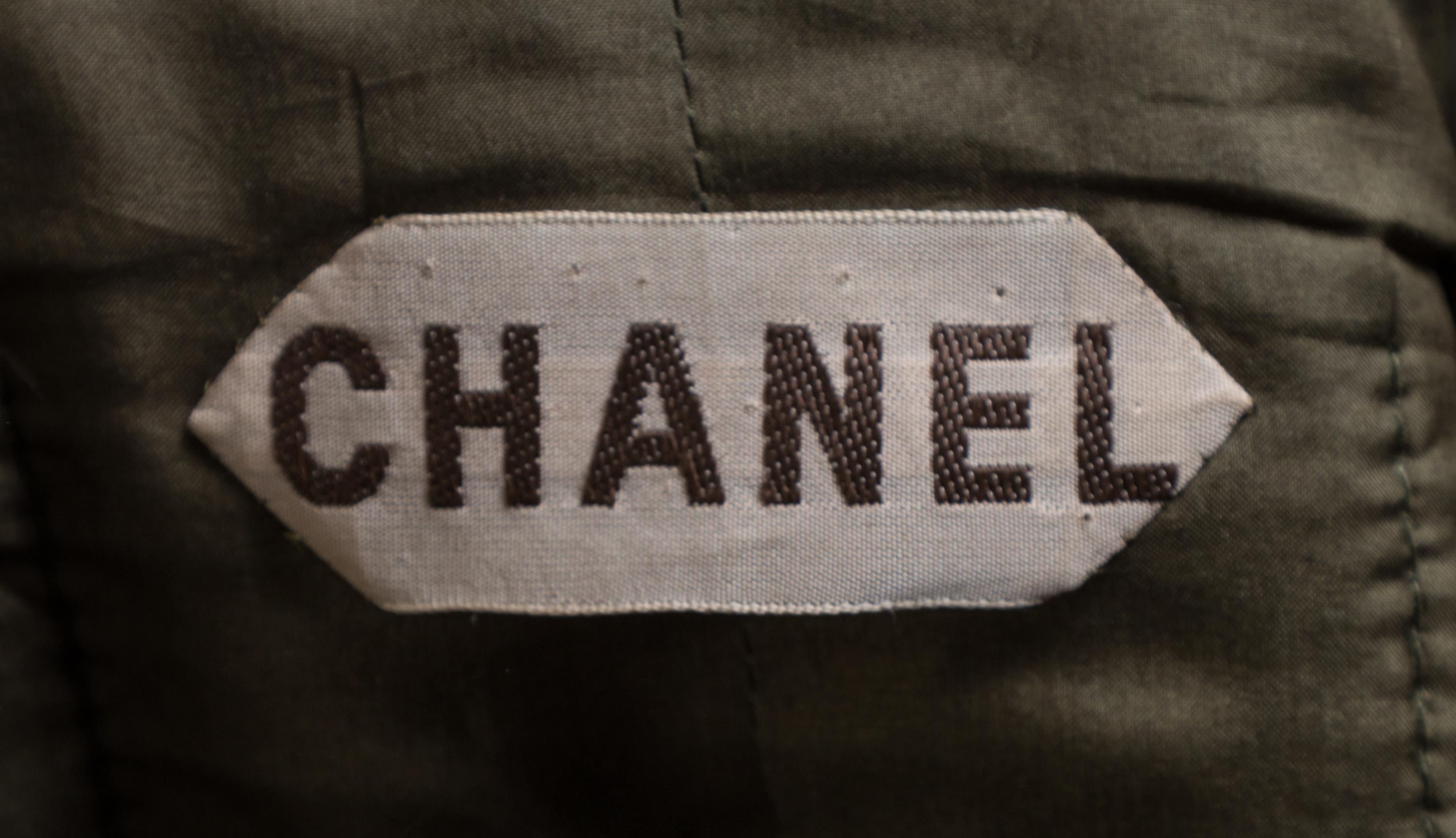 A Chanel Haute Couture 1950s Boucle Skirt Suit, No size; Belt: 26"- 28" x .75".