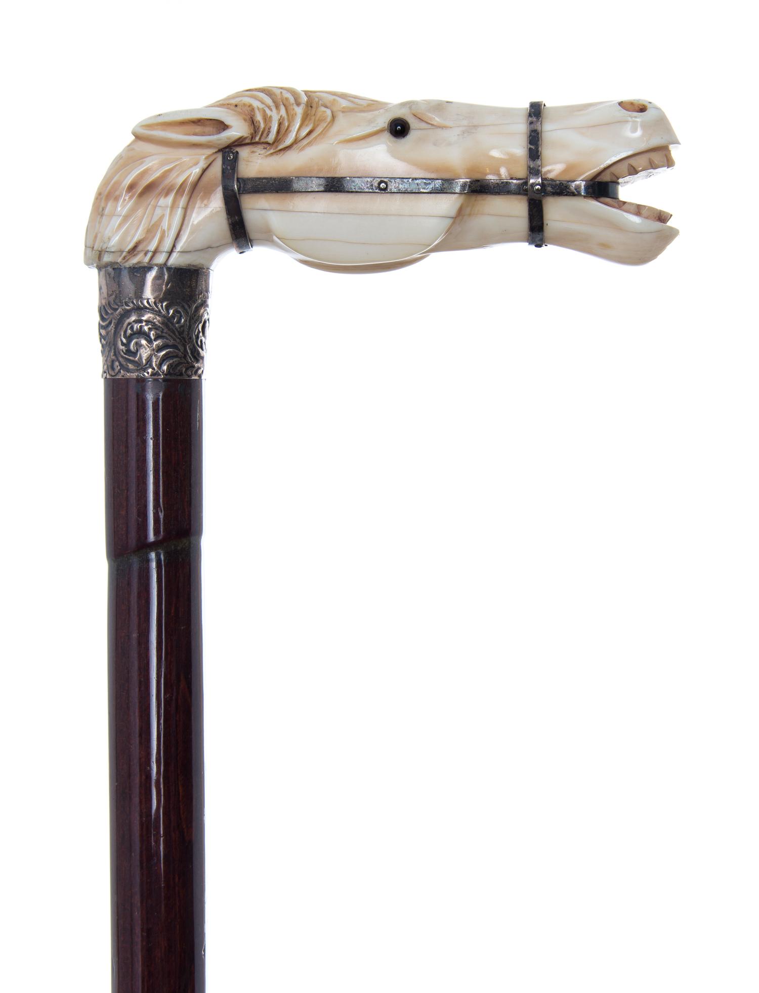 An American Ivory Handled Cane, Length of handle 4 1/4 x length overall 34 3/8 inches.