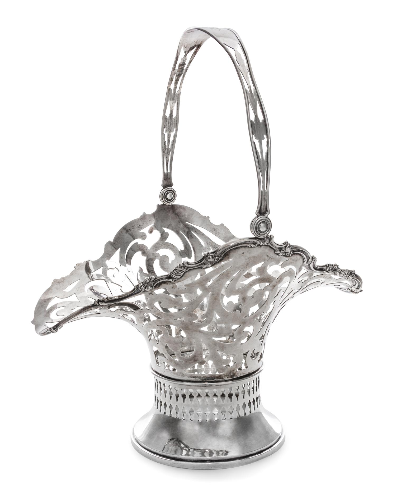 An American Silver Basket, Mauser Mfg. Co., New York, NY, 19th/20th Century, of oval, handled form with reticulated scrolling foliate d