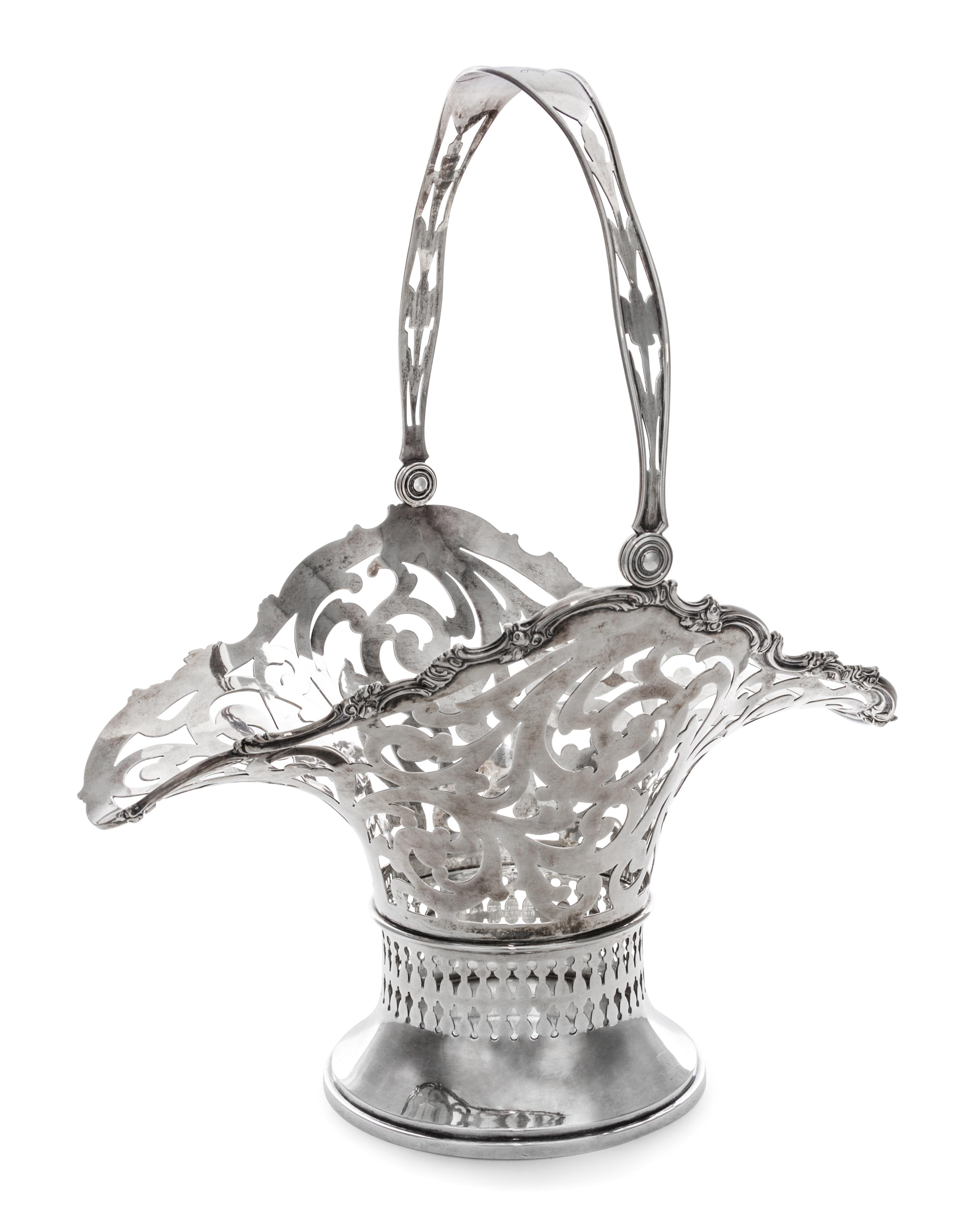 An American Silver Basket, Mauser Mfg. Co., New York, NY, 19th/20th Century, of oval, handled form with reticulated scrolling foliate d