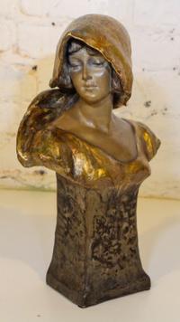 An Art Nouveau Terra Cotta Bust. Height 14 1/2 inches.
