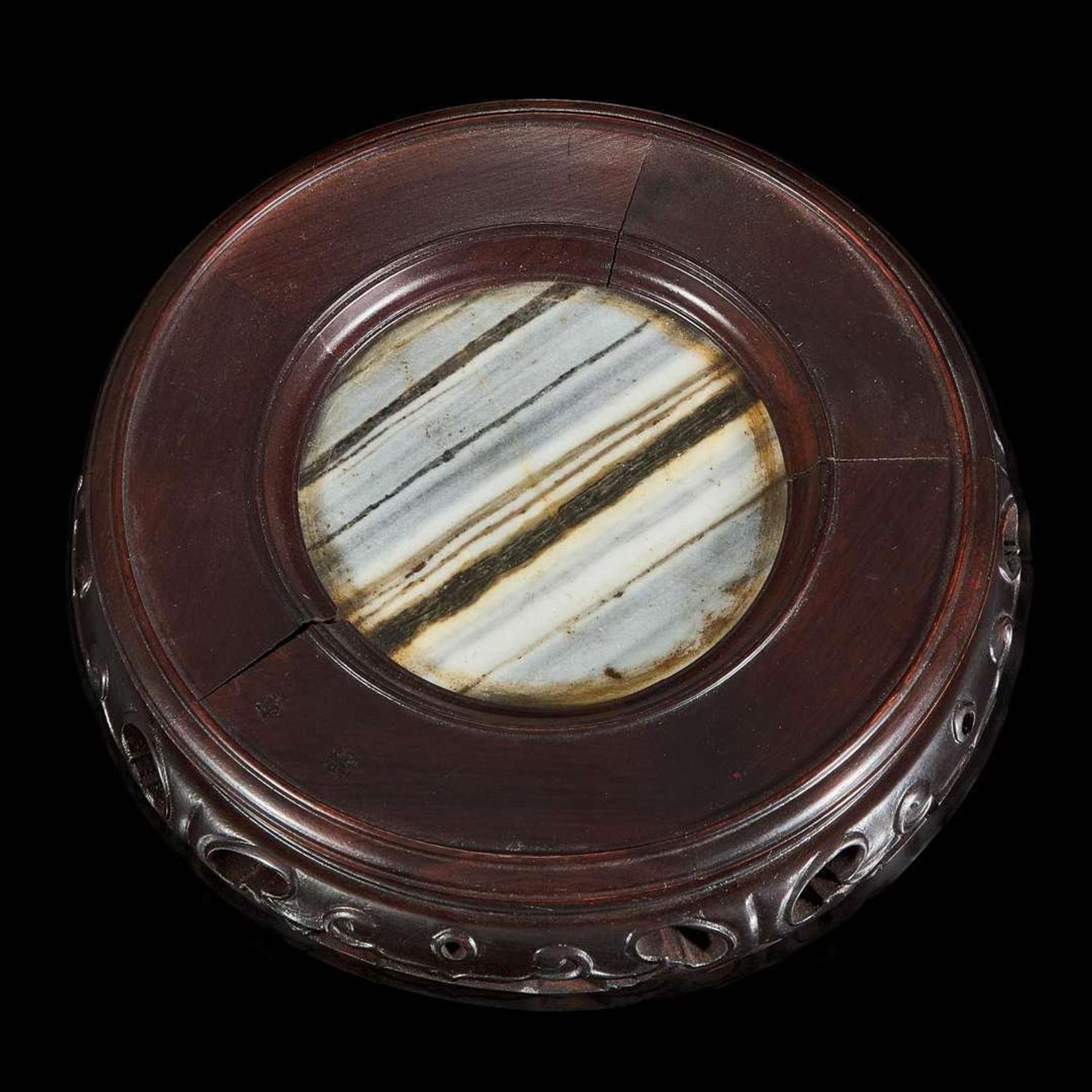 A Chinese carved dark green hardstone brushpot with marble-inlaid wood stand