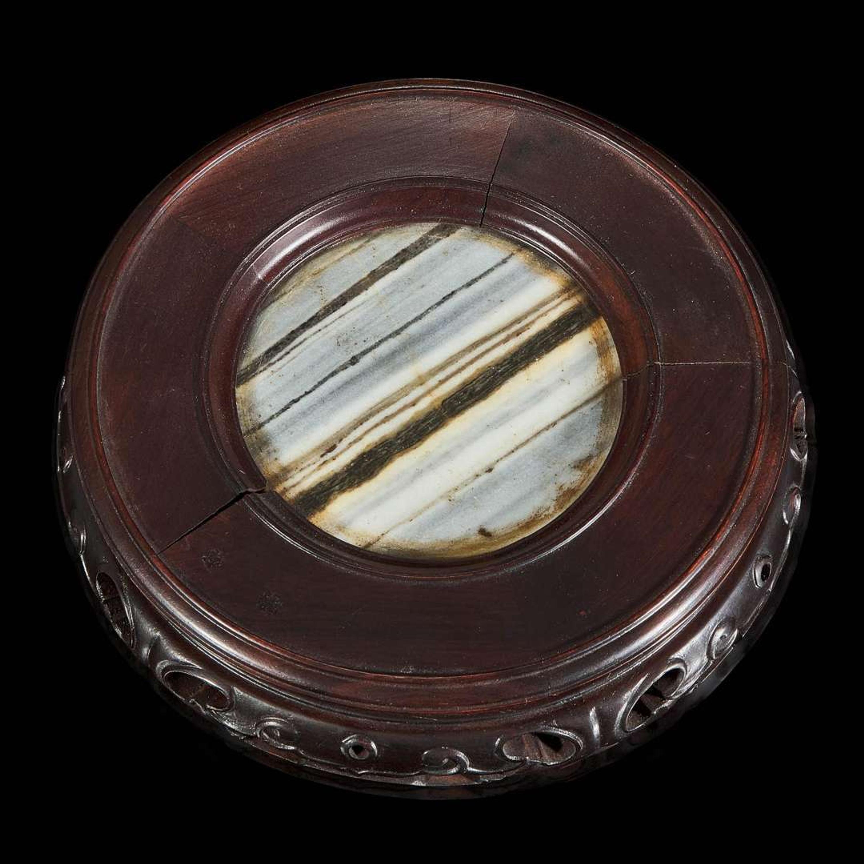A Chinese carved dark green hardstone brushpot with marble-inlaid wood stand