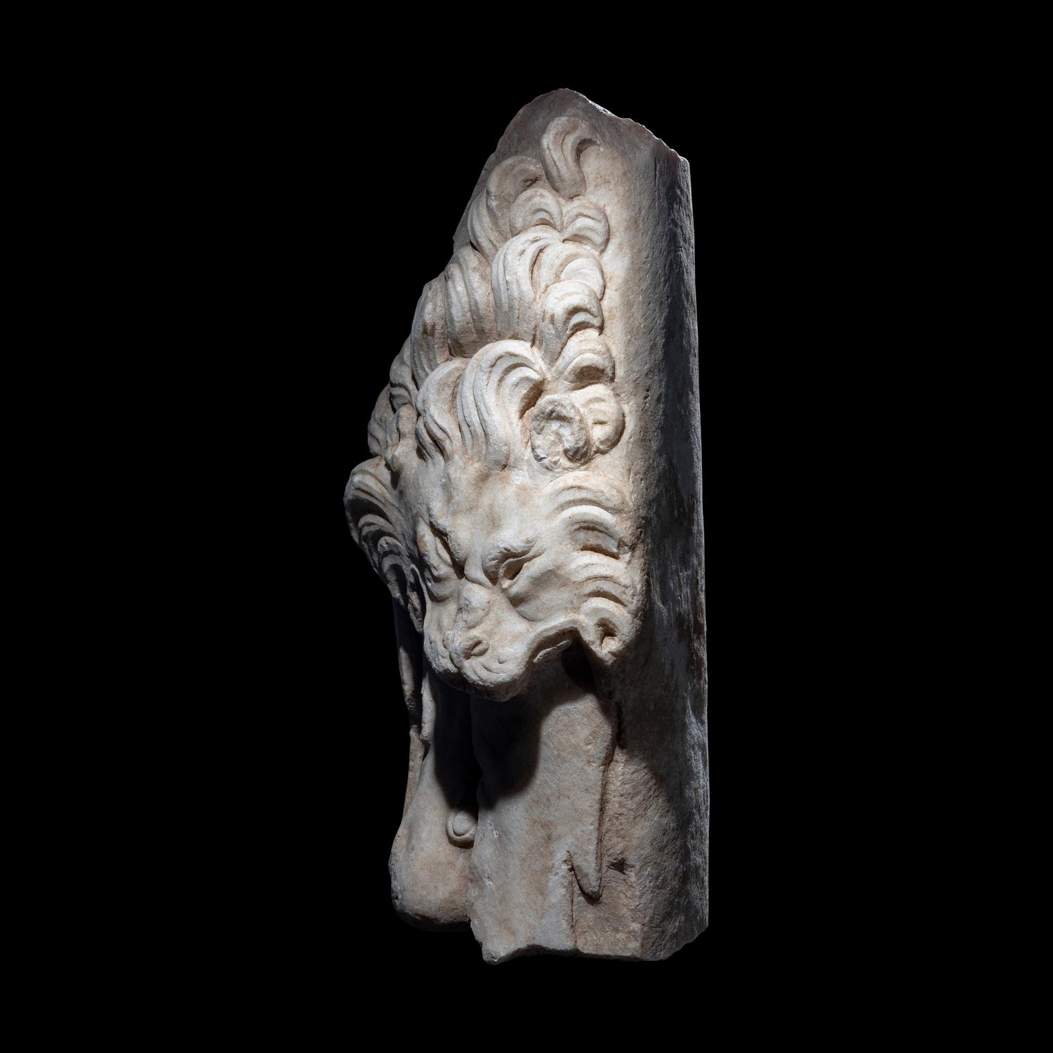 A Roman Marble Support in the form of the Nemean Lion Skin and Club of Hercules
