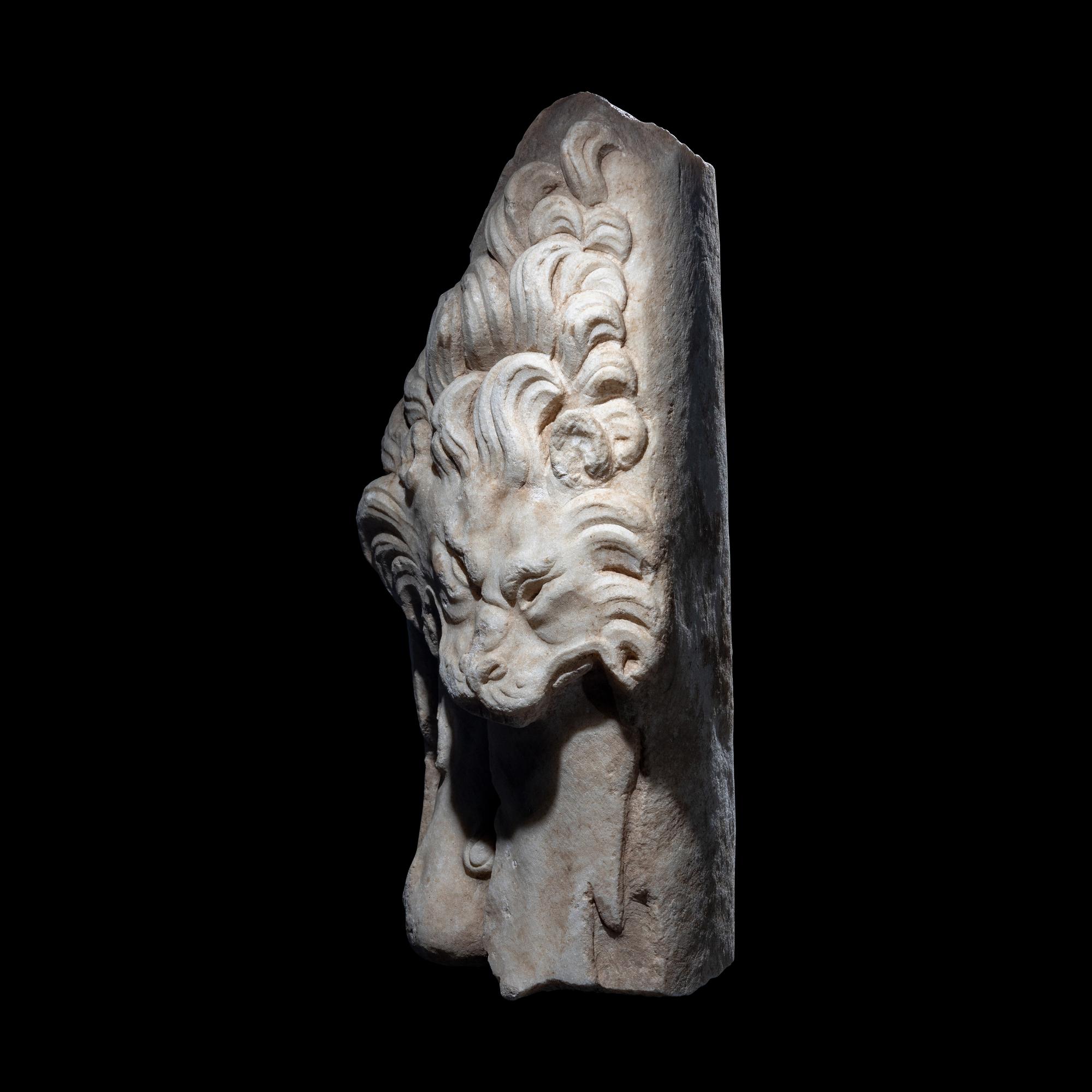 A Roman Marble Support in the form of the Nemean Lion Skin and Club of Hercules