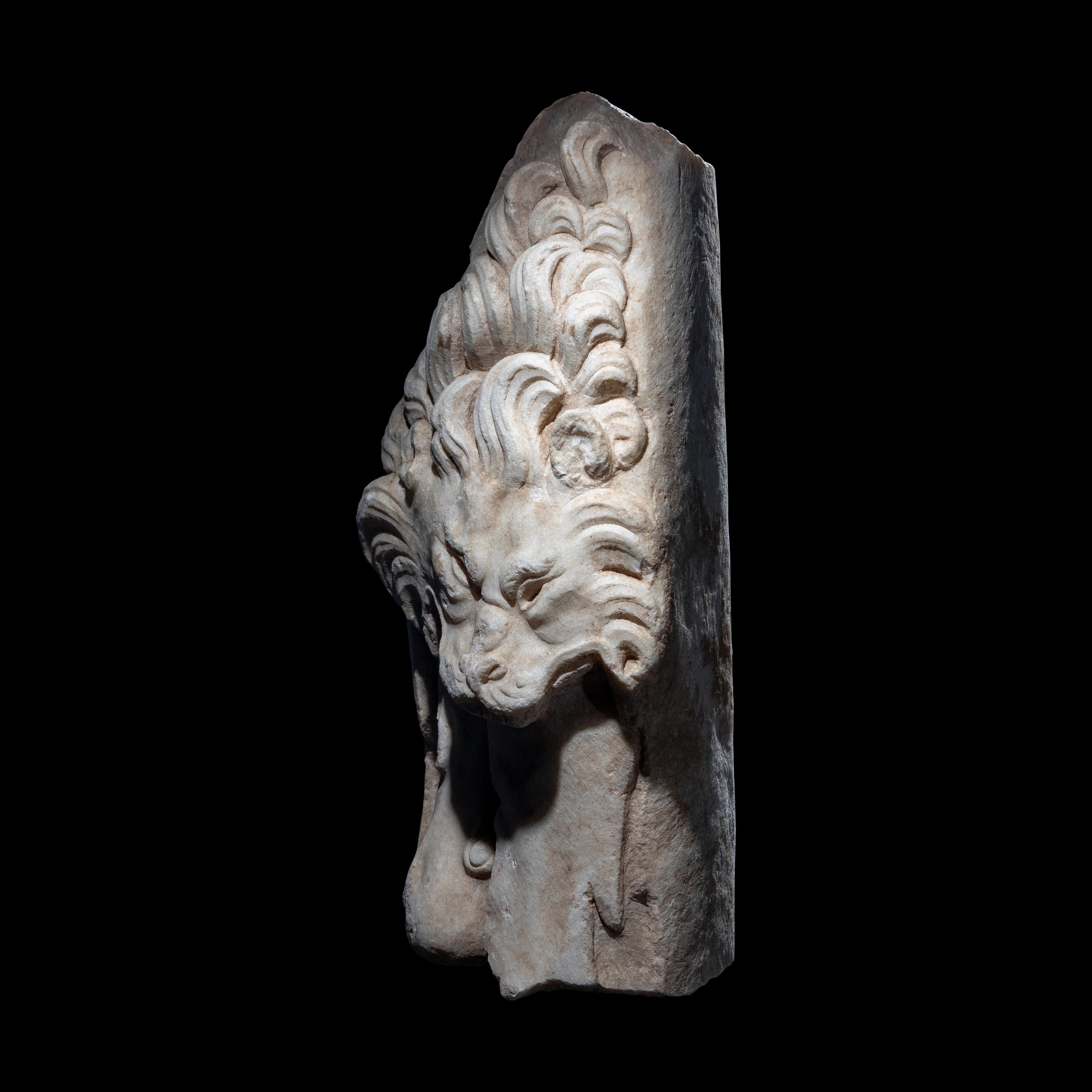 A Roman Marble Support in the form of the Nemean Lion Skin and Club of Hercules
