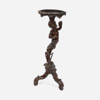 A George II Carved Mahogany Figural Tripod Table First half 18th century